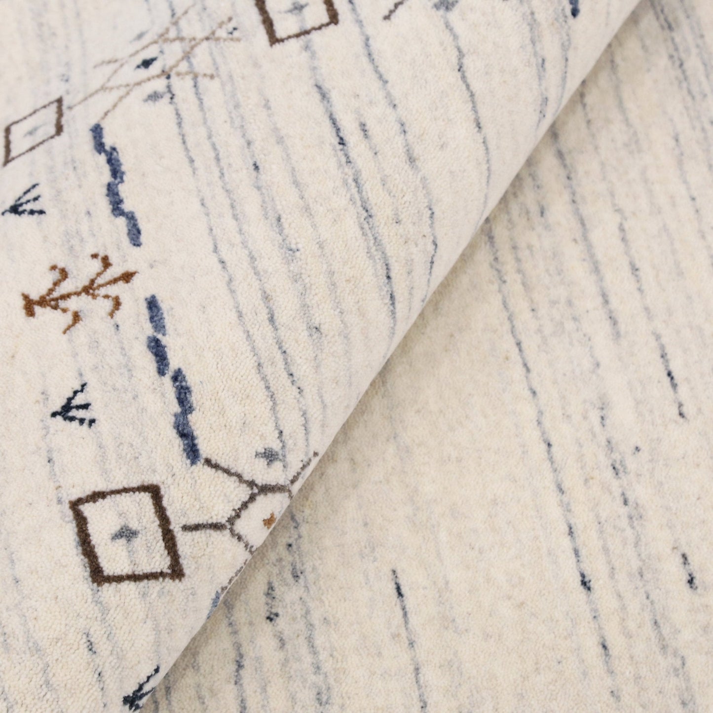 Ivory And Blue Tribal Border Design Hand Loomed Wool Area Rug.