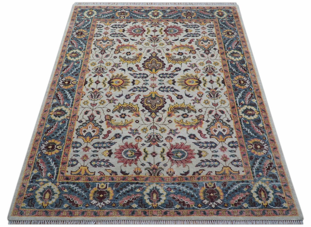 Kelly Turkish Design Ivory And Blue Hand Knotted Wool Rug.