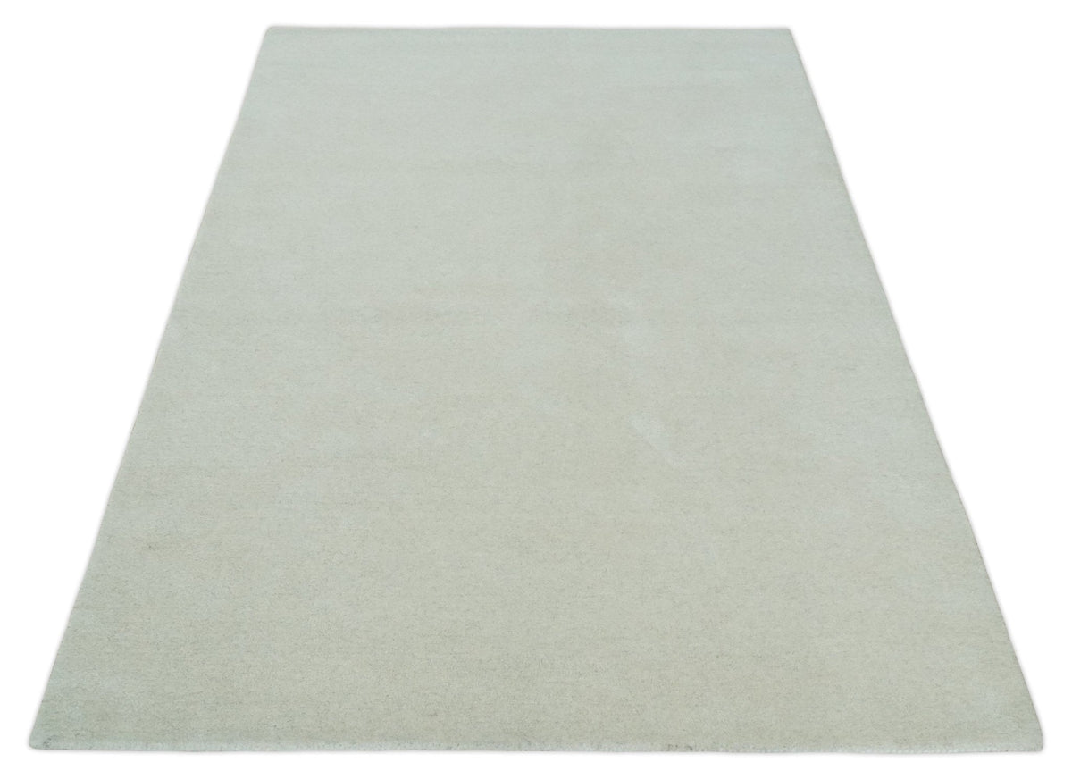 Custom Made Modern Solid Ivory Hand Tufted Wool Rug.