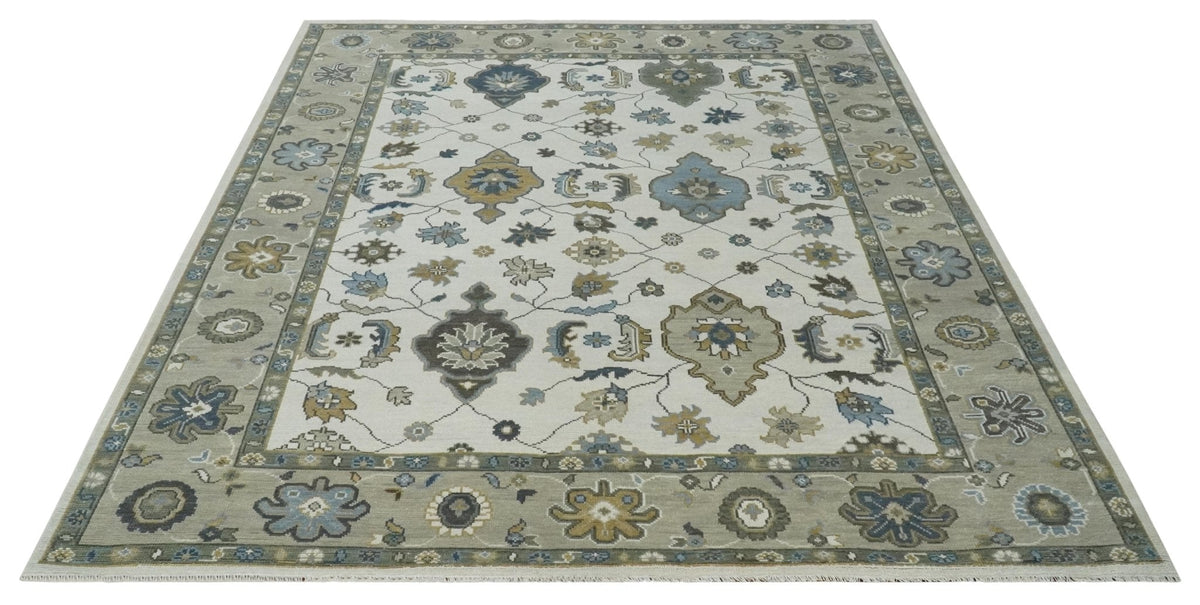 Traditional Ivory and Beige Hand Knotted Oriental Oushak Wool Area Rug.