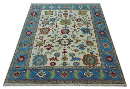 Fine Traditional Ivory and Blue Colorful Hand knotted Oushak Wool Area Rug.