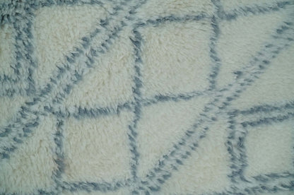 Modern Ivory and Blue Moroccan Hand Made Wool Area Rug.