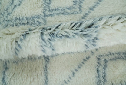 Modern Ivory and Blue Moroccan Hand Made Wool Area Rug.