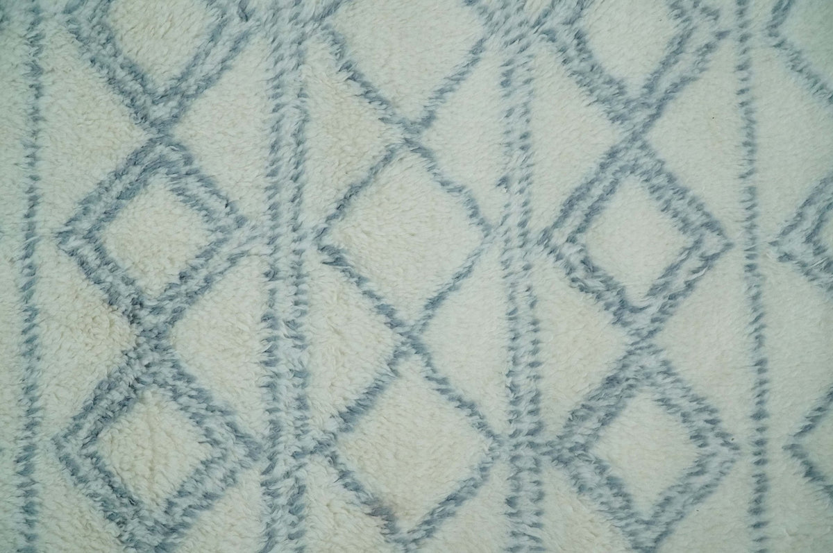 Modern Ivory and Blue Moroccan Hand Made Wool Area Rug.