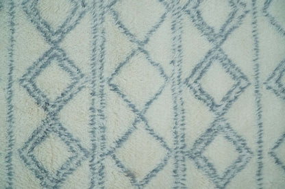 Modern Ivory and Blue Moroccan Hand Made Wool Area Rug.
