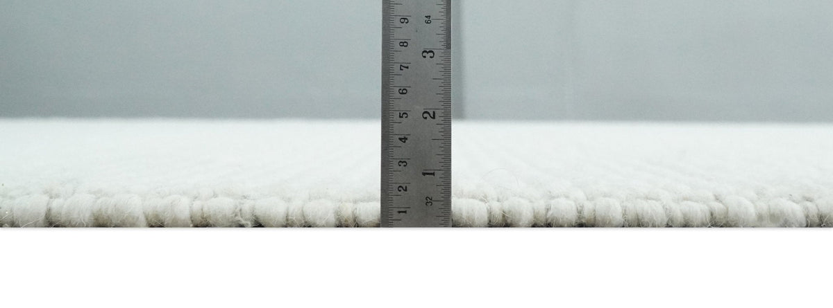 Contemporary Solid Design Ivory Handwoven Wool Area Rug.