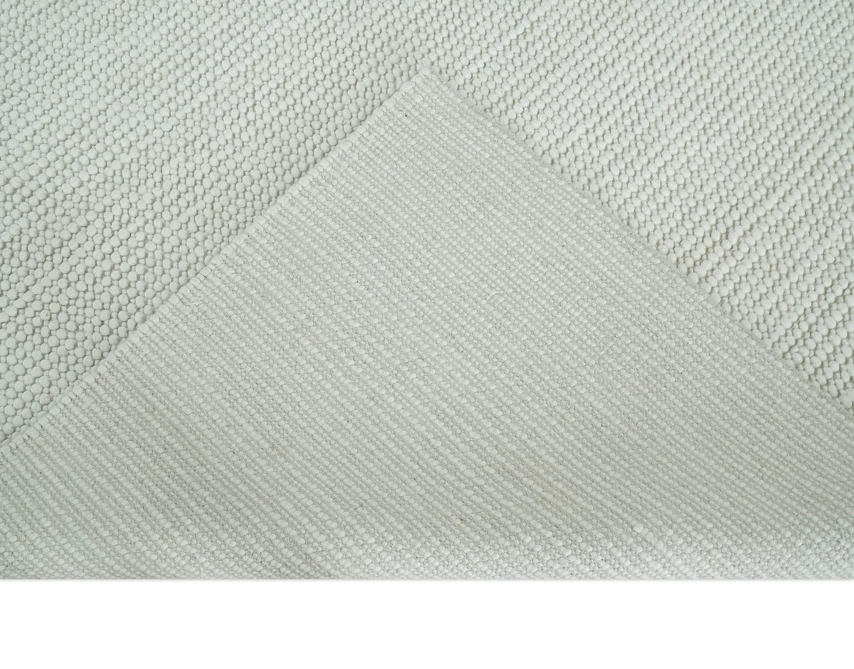 Contemporary Solid Design Ivory Handwoven Wool Area Rug.