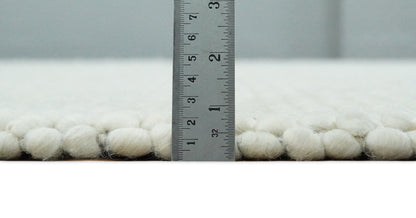Solid Ivory Wool Felted Chunky Hand Woven Contemporary Area Rug.