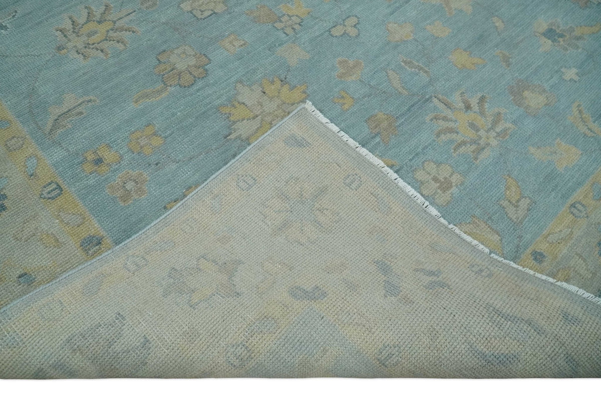 Blue and Beige Traditional Floral Hand Knotted Wool Rug.