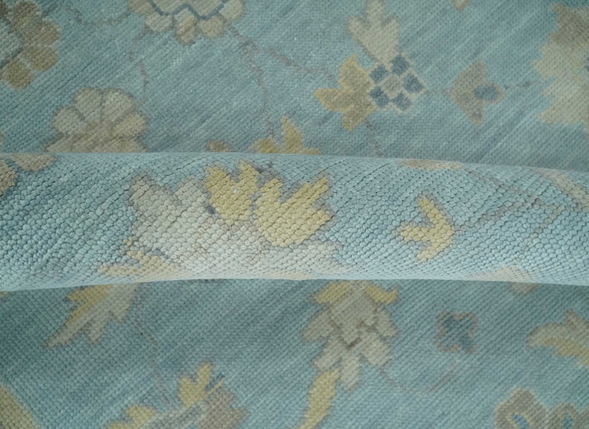 Blue and Beige Traditional Floral Hand Knotted Wool Rug.