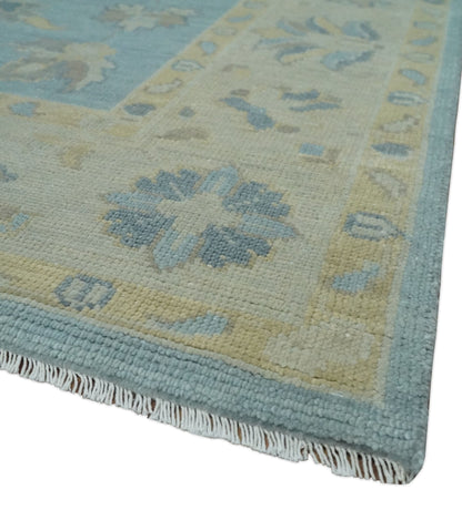 Blue and Beige Traditional Floral Hand Knotted Wool Rug.