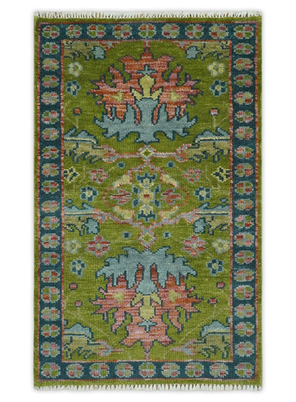 8x10 Green, Blue and Peach Hand Knotted Vibrant Donegal Floral Wool Rug.