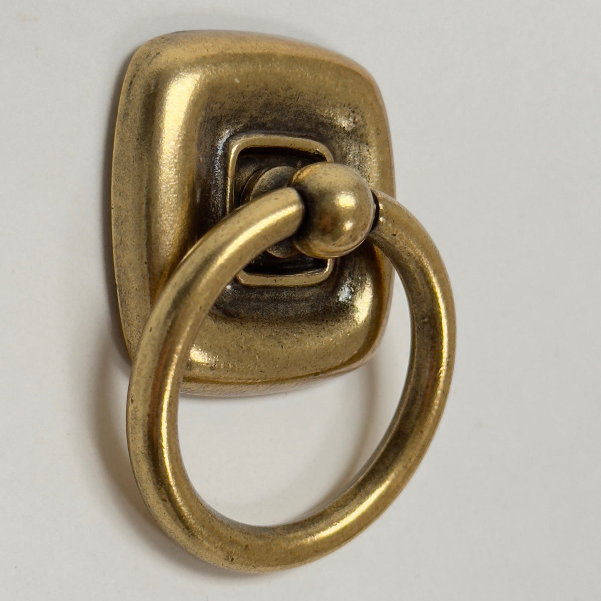 Ring Pull and Knob "Luca" Cabinet Pulls with Backplate in Antique Brass.