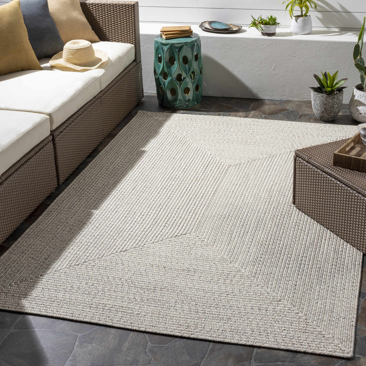 Beige Braided Faux Jute Outdoor Rug.