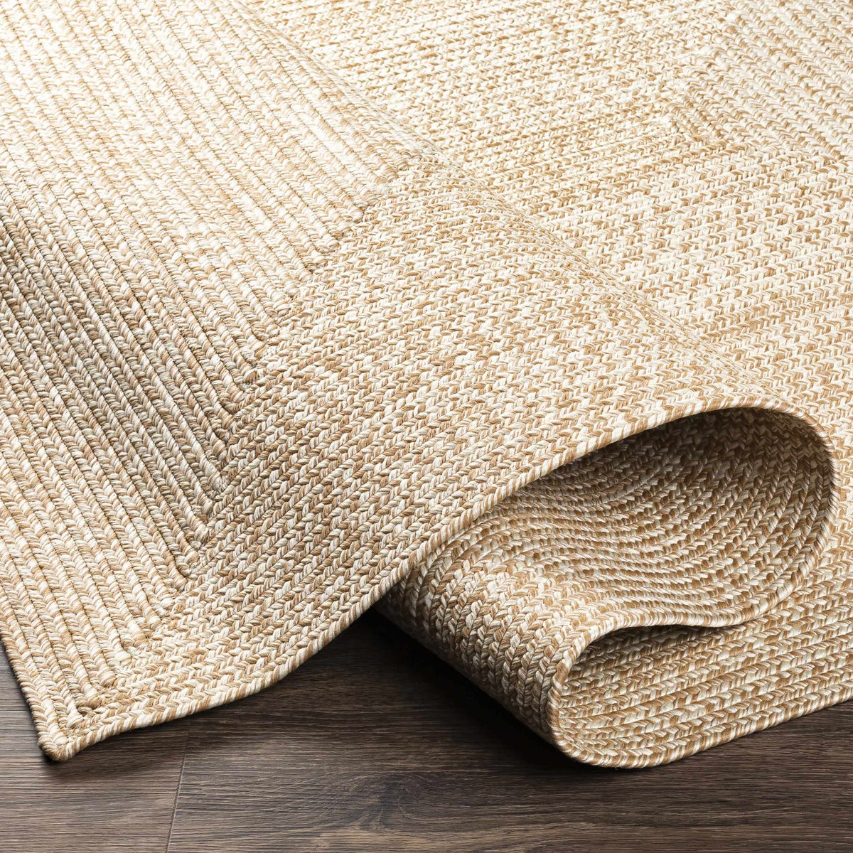 Cream Braided Faux Jute Outdoor Rug.