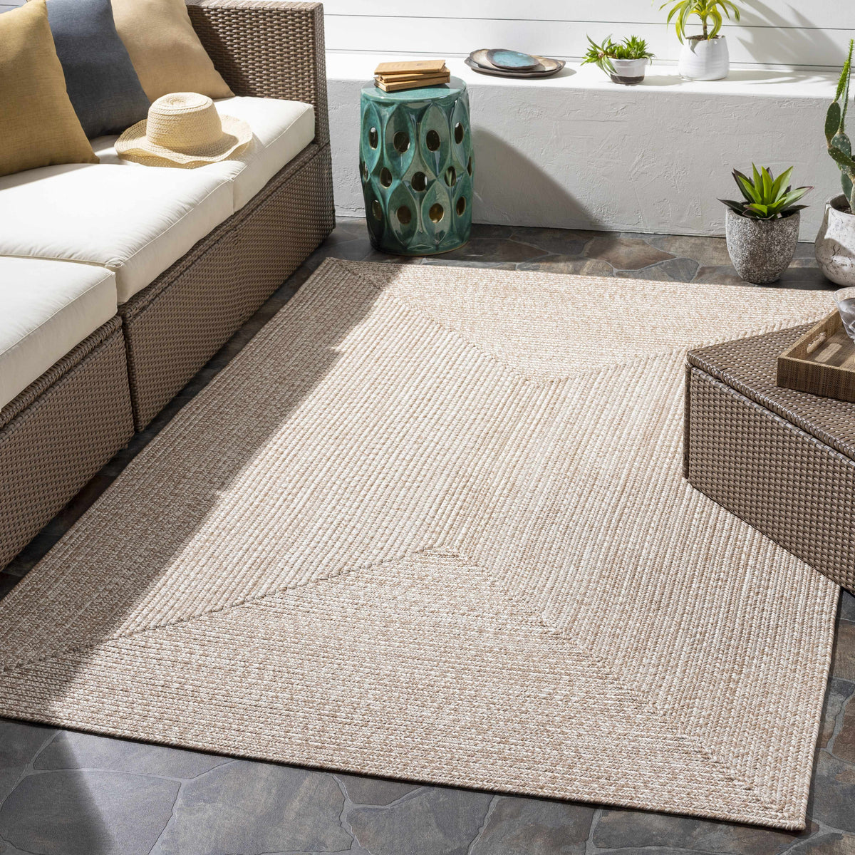 Cream Braided Faux Jute Outdoor Rug.