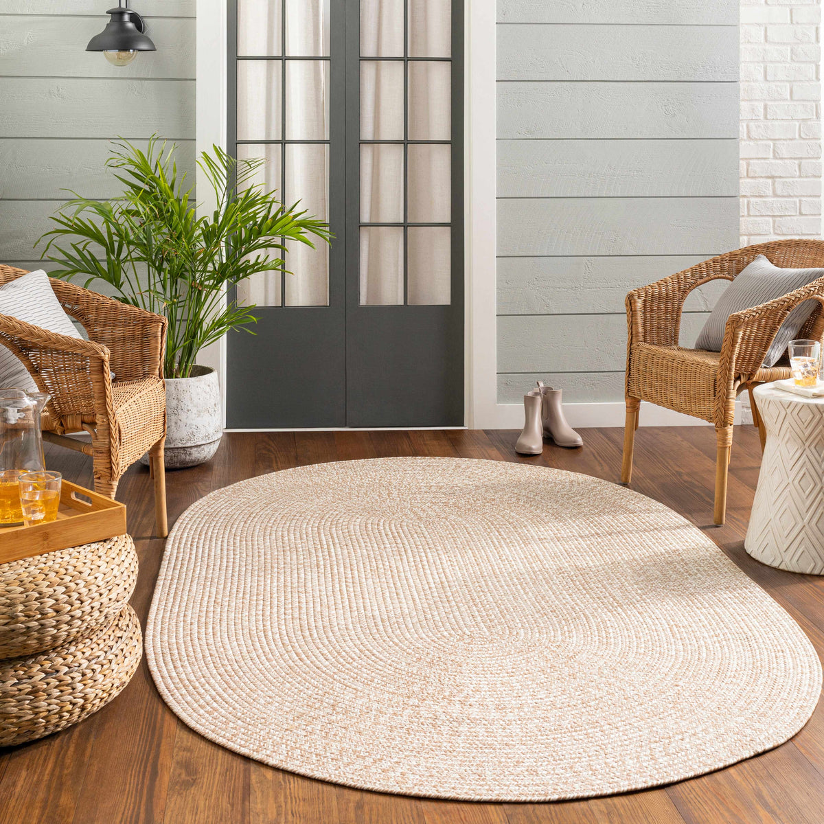 Cream Braided Faux Jute Outdoor Rug.