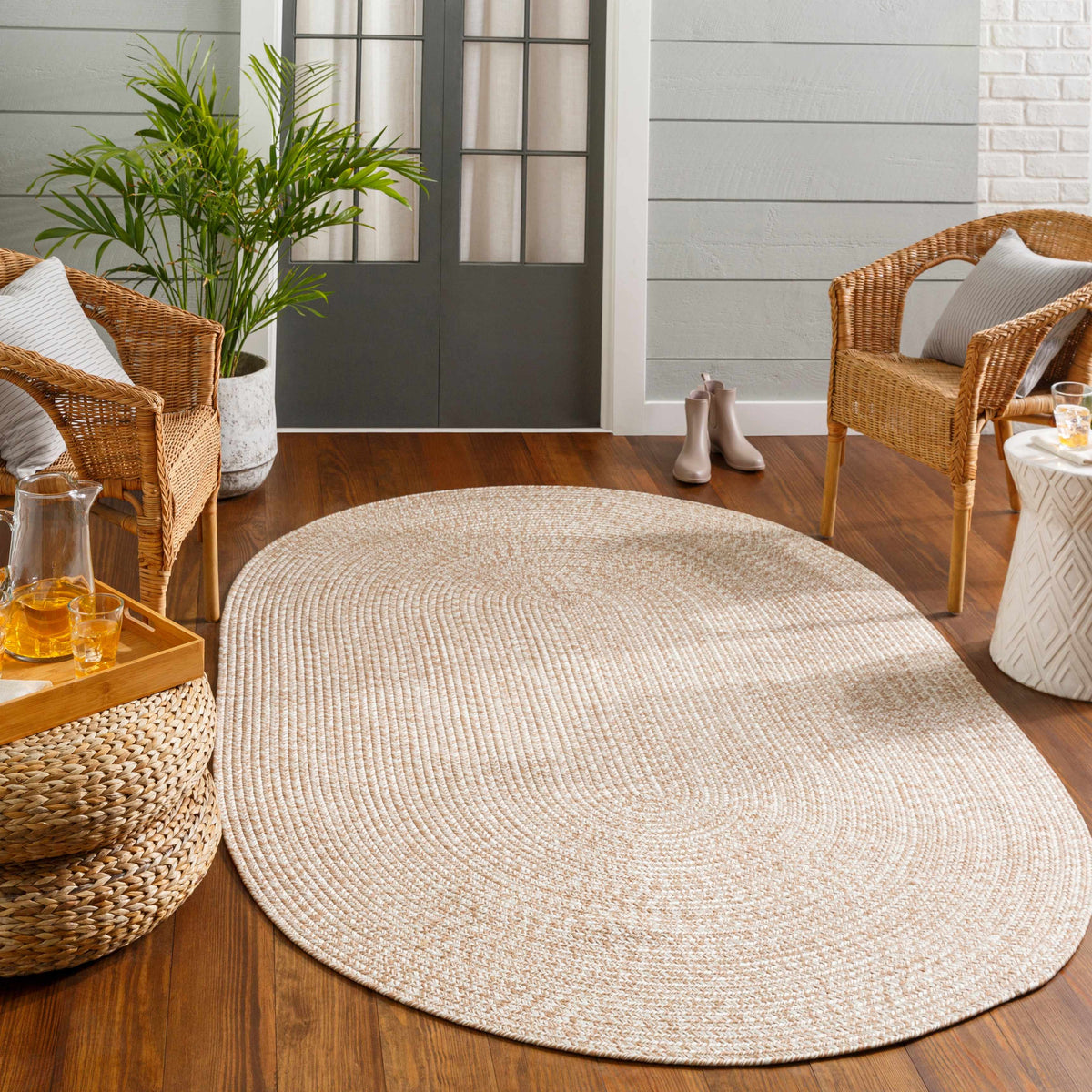 Cream Braided Faux Jute Outdoor Rug.