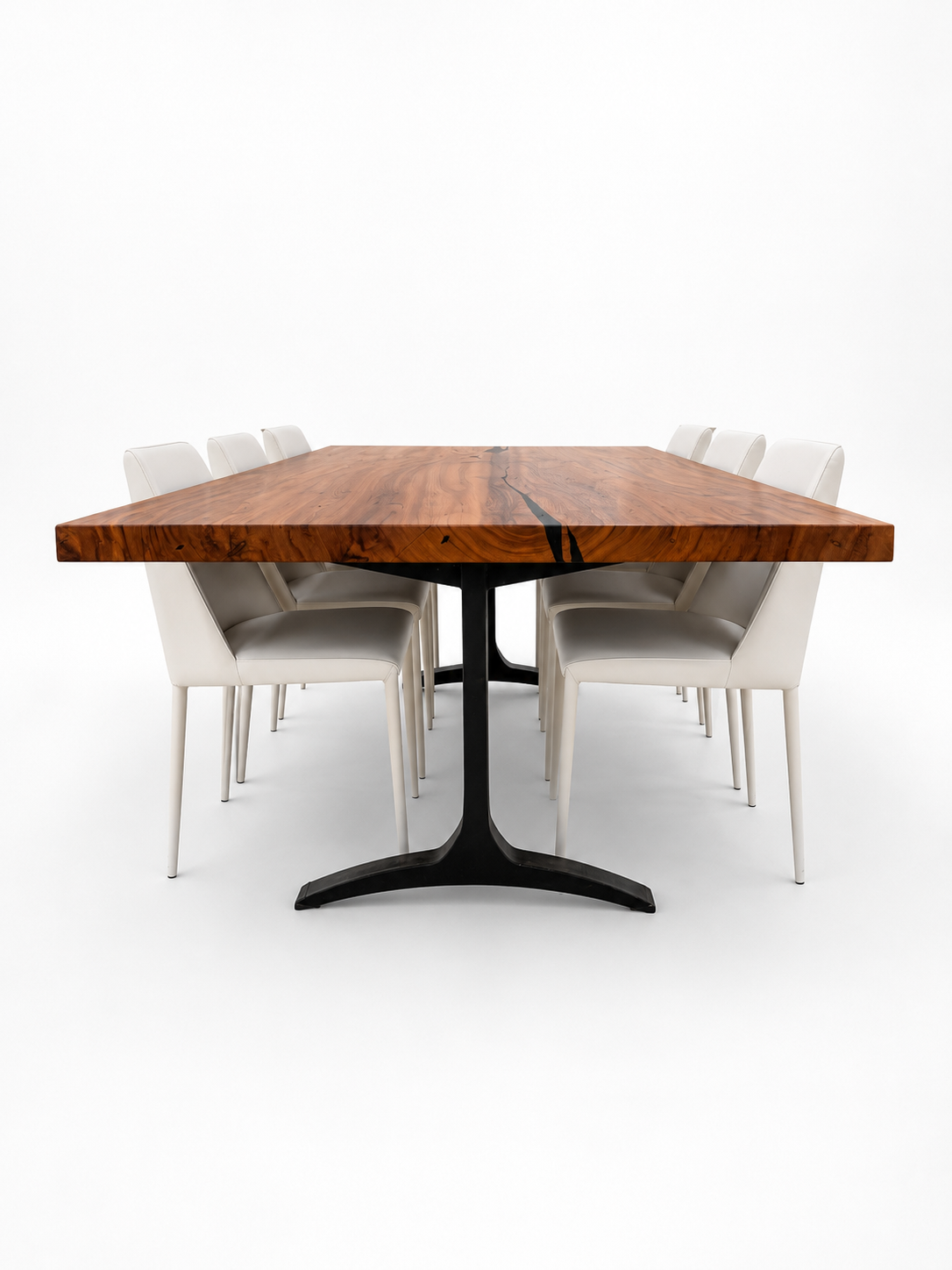 Wooden dining table with six white chairs on a white background