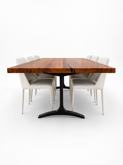 Wooden dining table with six white chairs on a white background