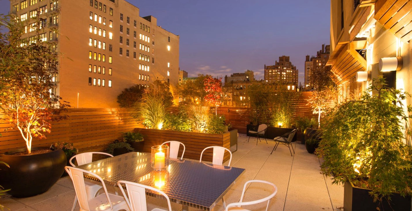 Custom rooftop fencing with planters and outdoor lighting created by TCSC