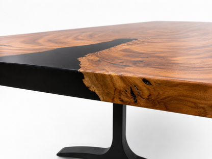 Wooden table with black base on a white background
