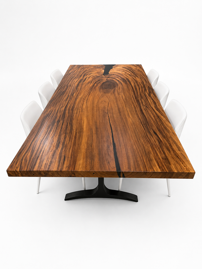 Wooden dining table with a black base on a white background