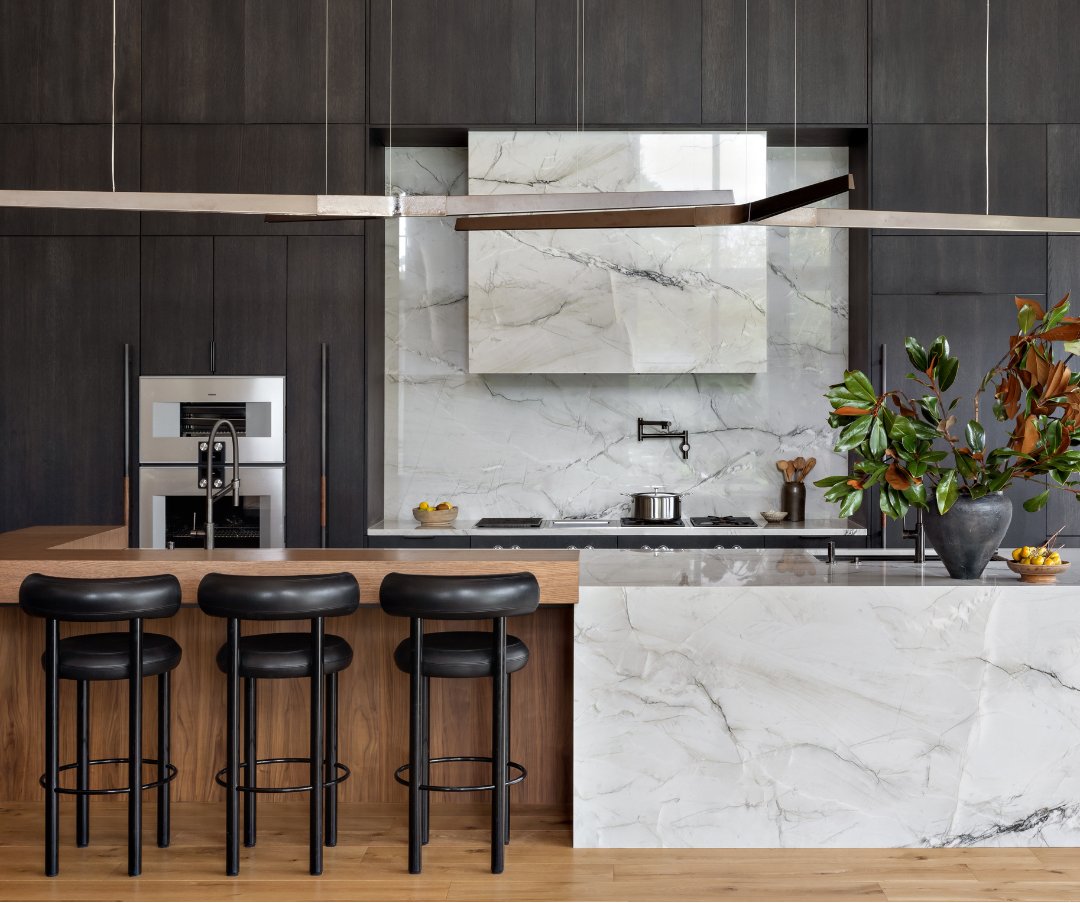 Modern kitchen with marble island and bar stools