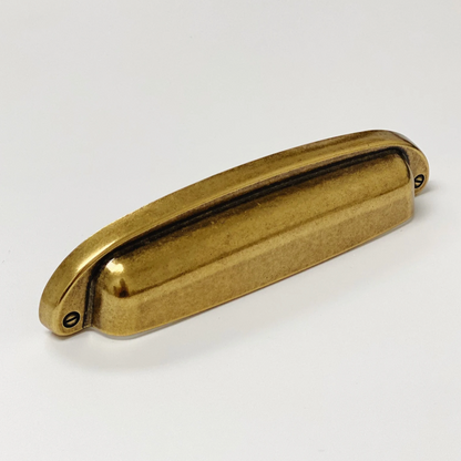 Drawer Cup Pull "Capri" in Antique Brass.
