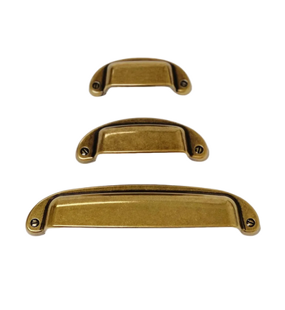 Drawer Cup Pull "Capri" in Antique Brass.