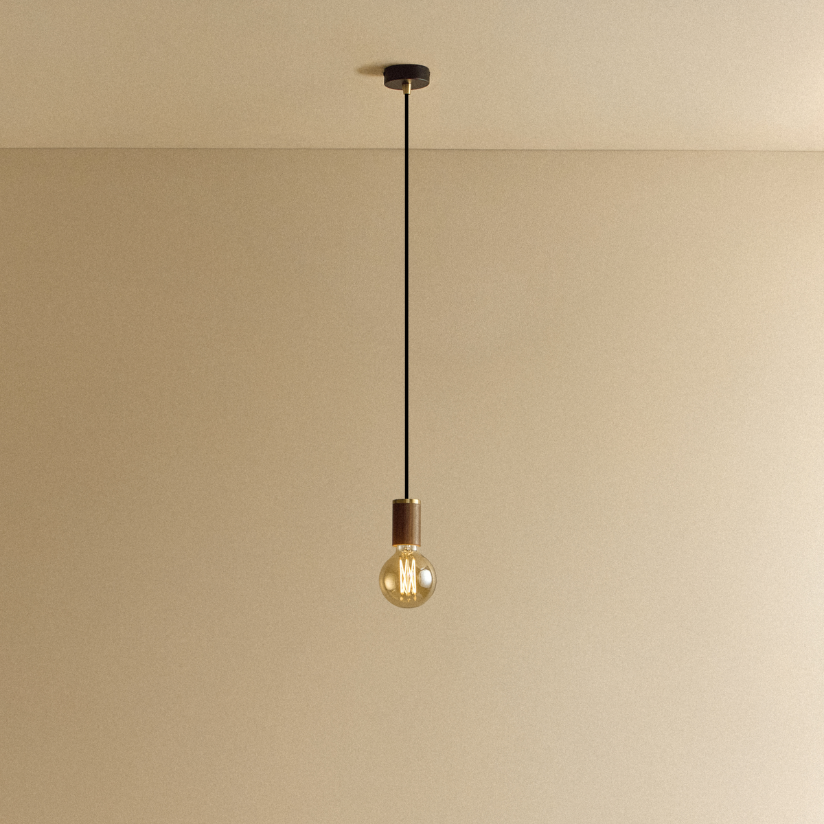Elva Pendant Light Tinted in Walnut.