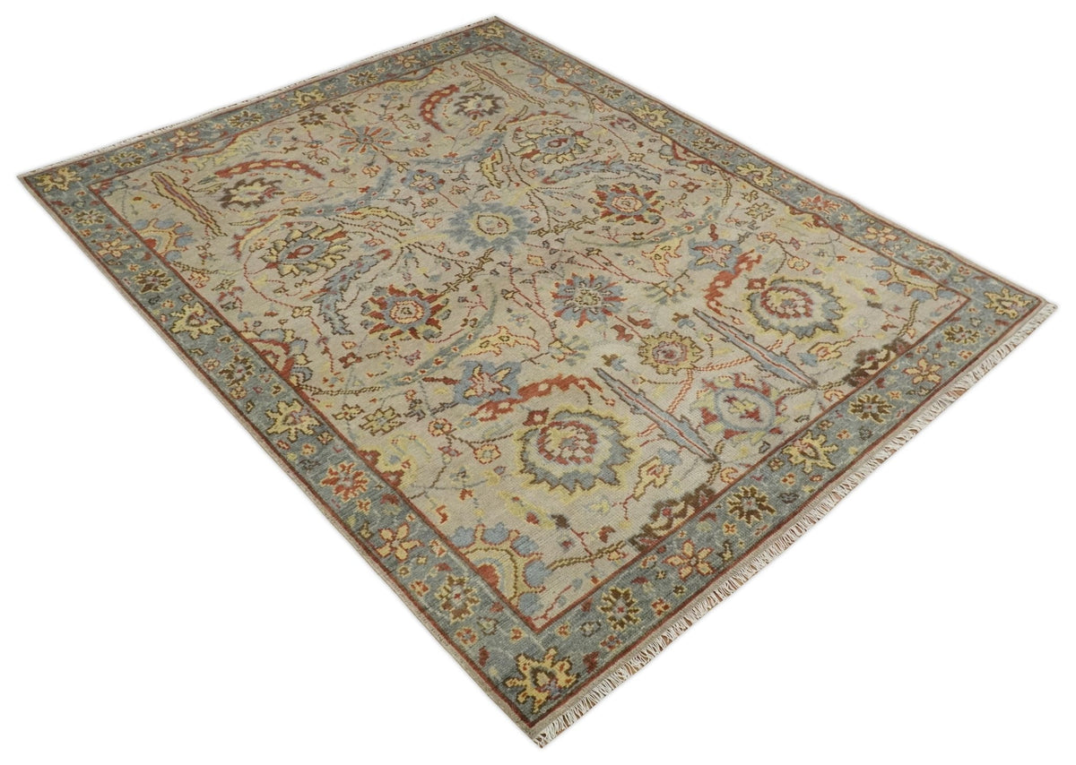 Custom Made Beige, Rust and Blue Traditional Style Hand Knotted Wool Area Rug.
