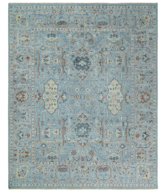 Antique Distressed finished Aqua, Beige and Brown Hand Knotted Low Pile Wool Area Rug.