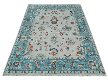 Ivory and Blue Hand knotted Traditional Oushak wool Area Rug.