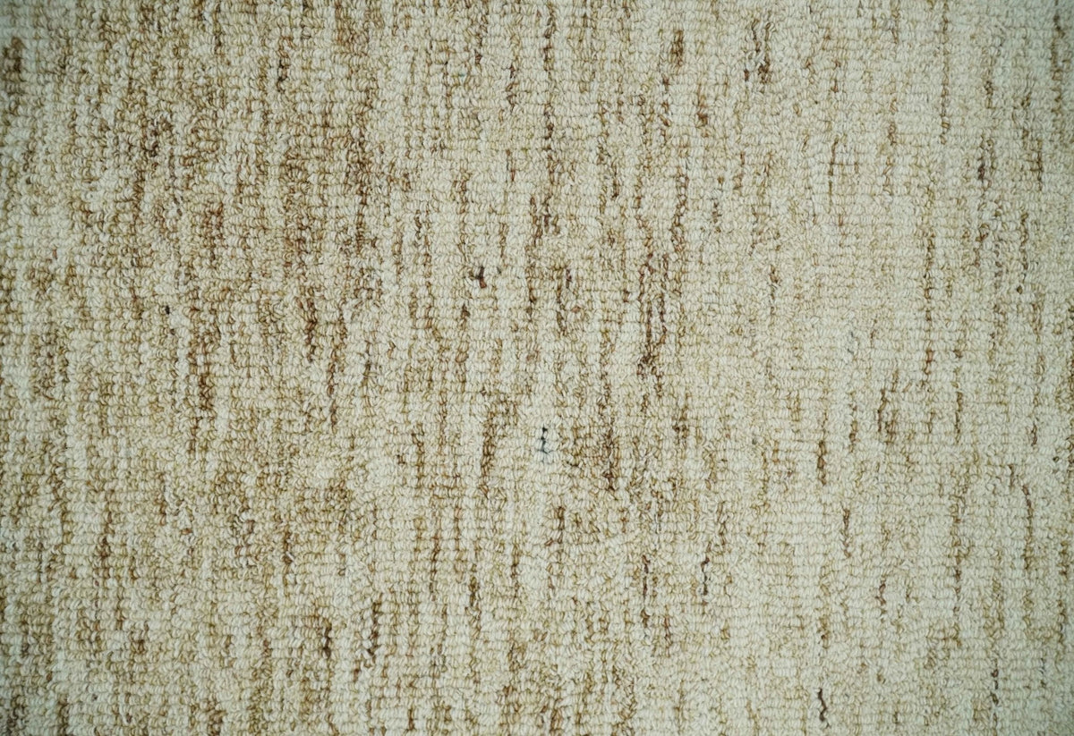 Beige and Ivory Modern Solid Hand Woven Wool Rug.