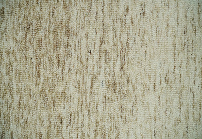Beige and Ivory Modern Solid Hand Woven Wool Rug.