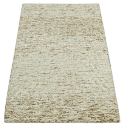 Beige and Ivory Modern Solid Hand Woven Wool Rug.