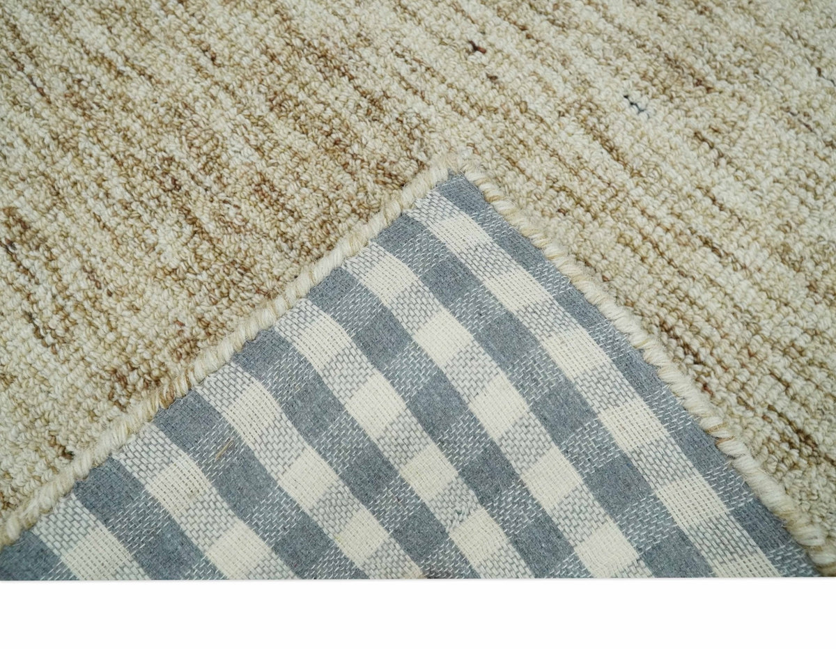 Beige and Ivory Modern Solid Hand Woven Wool Rug.