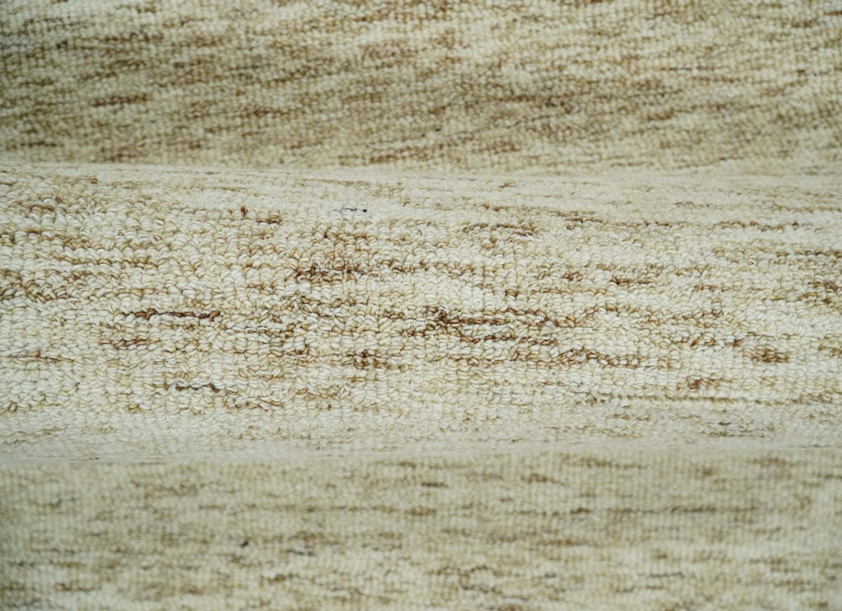 Beige and Ivory Modern Solid Hand Woven Wool Rug.