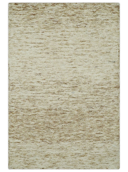 Beige and Ivory Modern Solid Hand Woven Wool Rug.