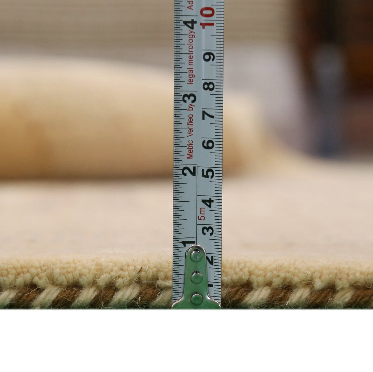 Beige Center Pattern Hand Loomed Wool Area Rug.