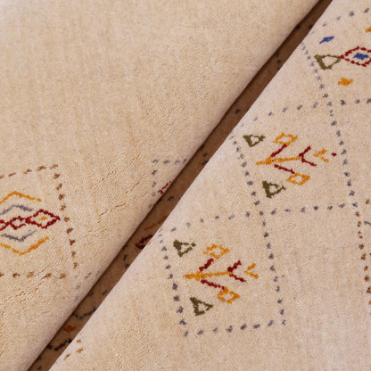 Beige Contemporary Tribal Design Hand Loomed Wool Rug.