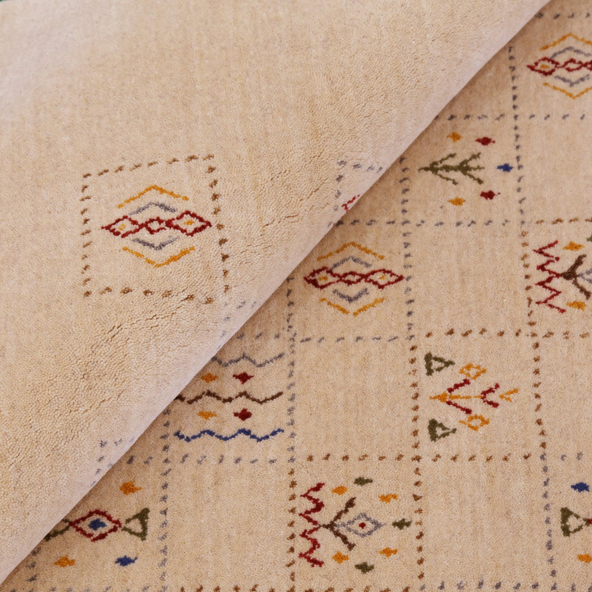 Beige Contemporary Tribal Design Hand Loomed Wool Rug.