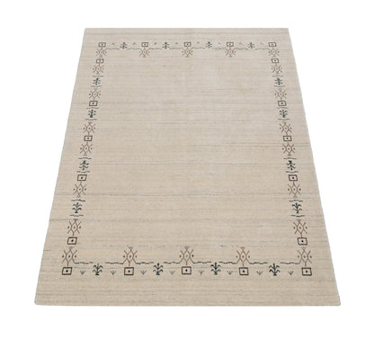 Beige Tribal Border Hand Loomed Wool Area Rug.