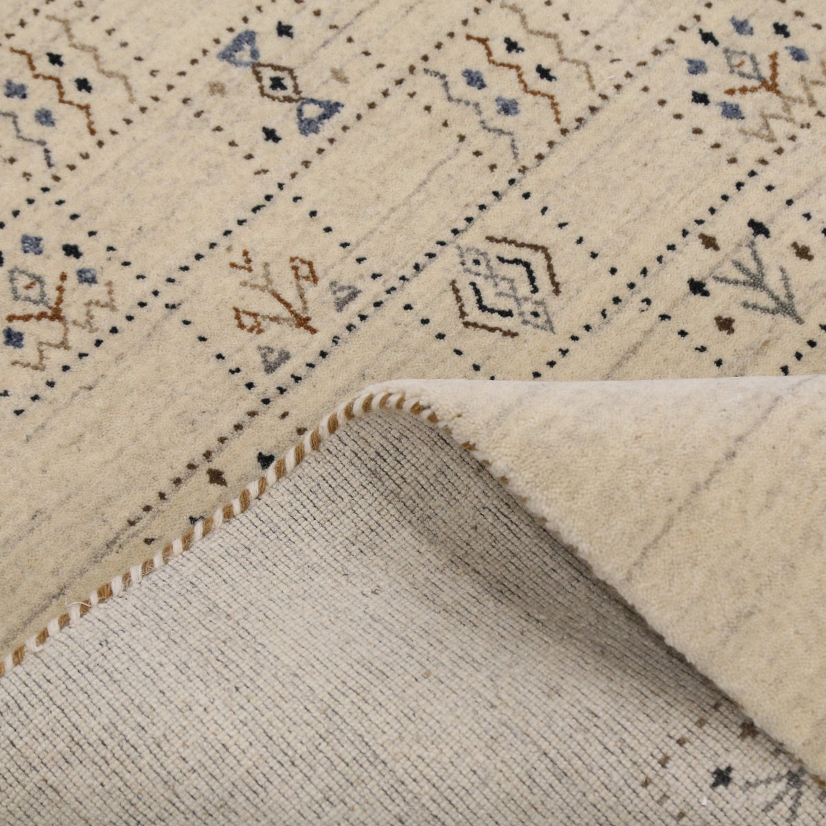 Beige Tribal Design Hand Loomed Wool Area Rug.