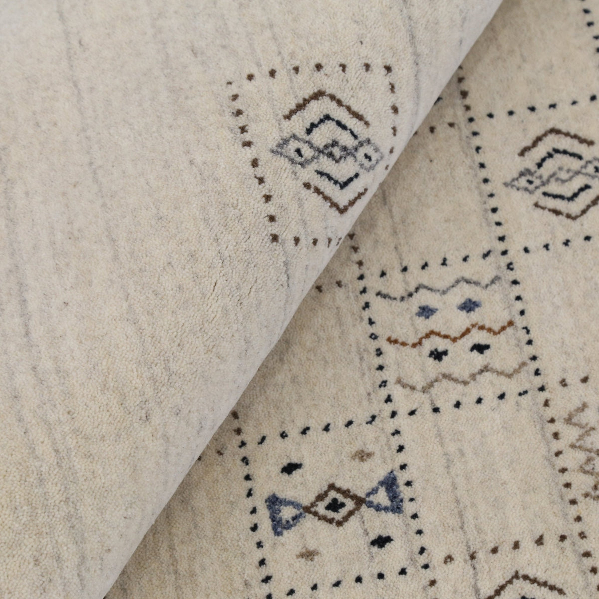 Beige Tribal Design Hand Loomed Wool Area Rug.