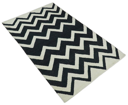 Black and Beige Chevron Design Hand Woven Dhurrie Rug.