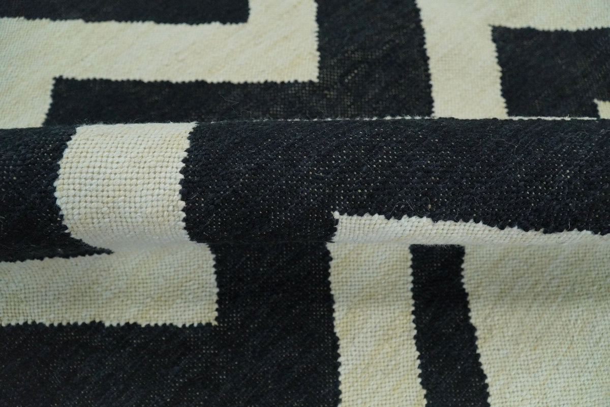 Black and Beige Chevron Design Hand Woven Dhurrie Rug.