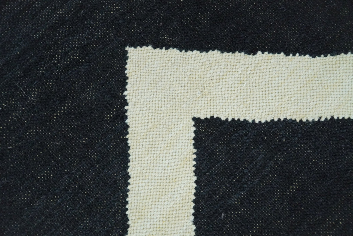 Black and Beige Chevron Design Hand Woven Dhurrie Rug.