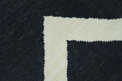 Black and Beige Chevron Design Hand Woven Dhurrie Rug.